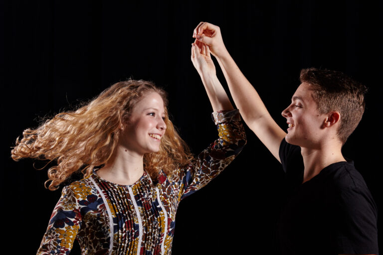 Young couple smiling and dancing CREDIT DusaGabor